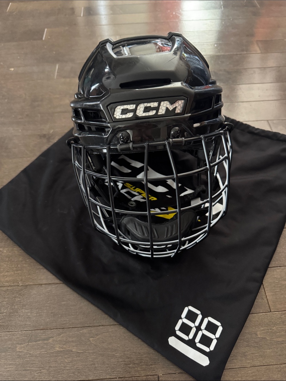 CCM Super TacksX Black Hockey Helmet with Black  and White Cage